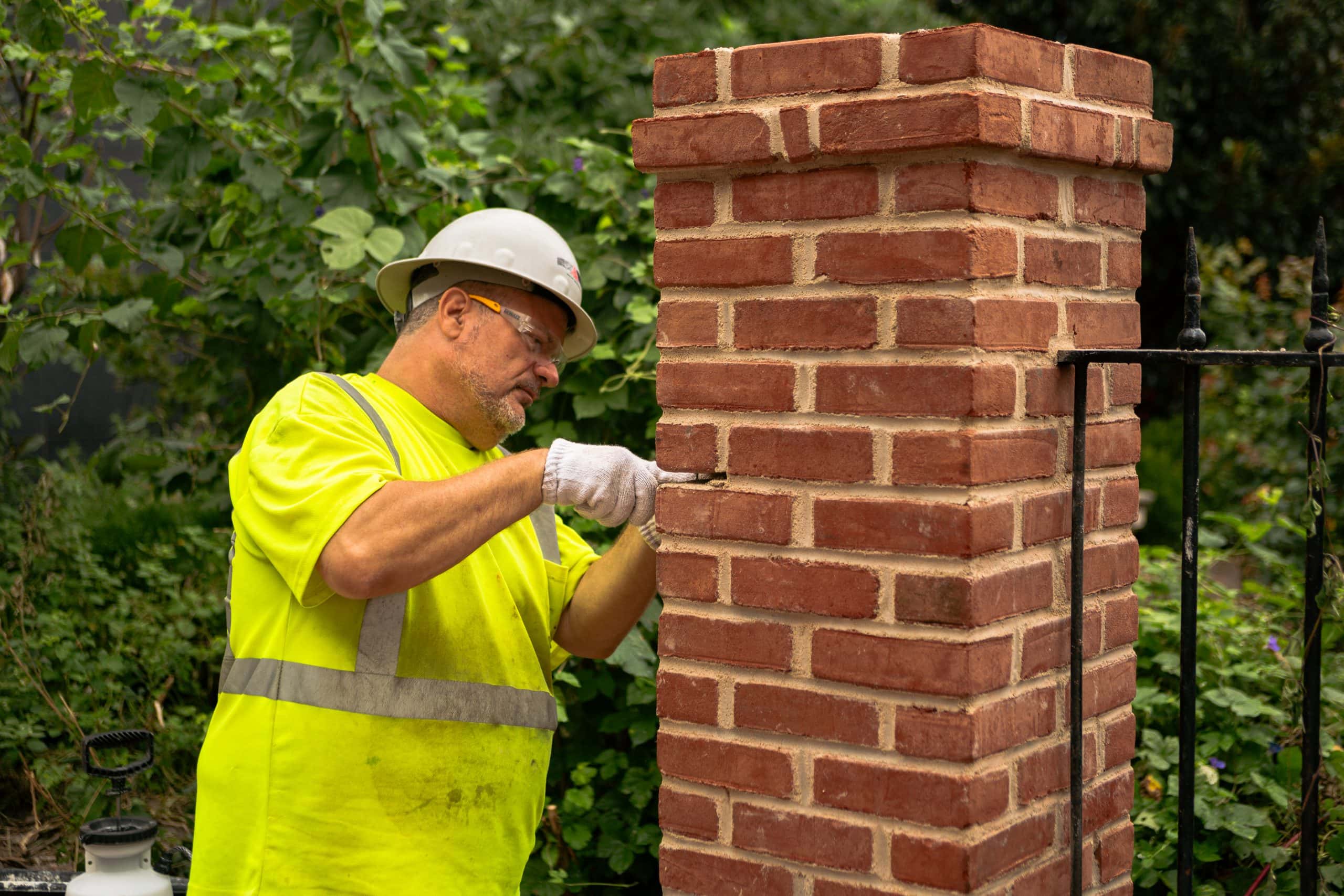 durable restoration employee replacing historic brick at flag house in baltimore maryland